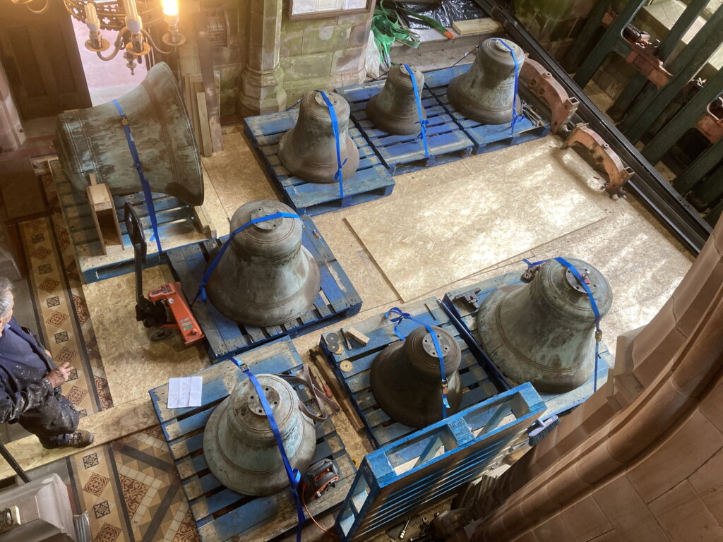 The eight Arlecdon bells on pallets in the church narthex