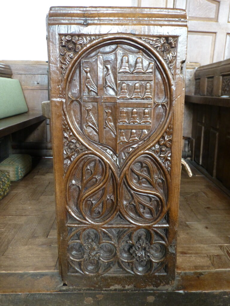 Carved pew end at Crowcombe, Someset