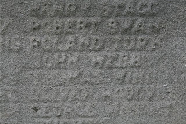 Detail on war memorial panel in churchyard