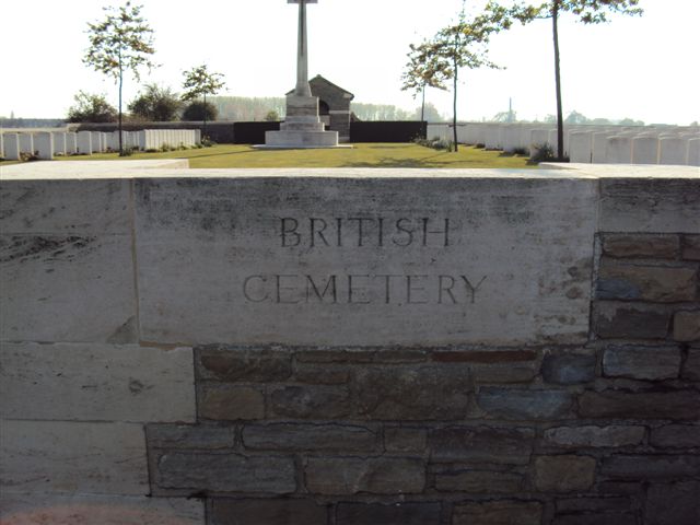 Inscription on wall to right of gate