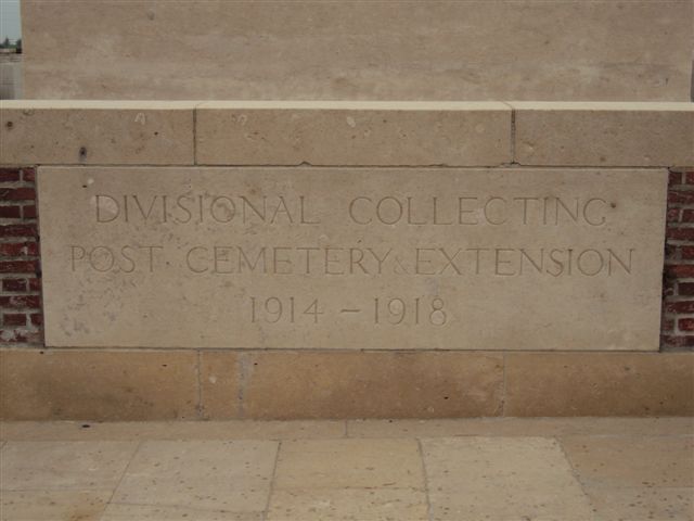 Name inscription on cemetery wall with Stonce of Remembrance in background