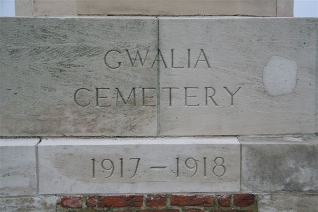 Name inscription at base of Cross at entrance